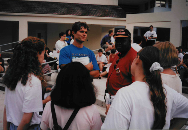 Anthony Shriver talking to a group of students at the the campus Best Buddies International event